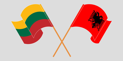 Crossed and waving flags of Albania and Lithuania