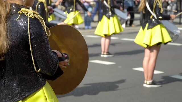 Close-up of female hands drummers are knocking in the drum of their sticks