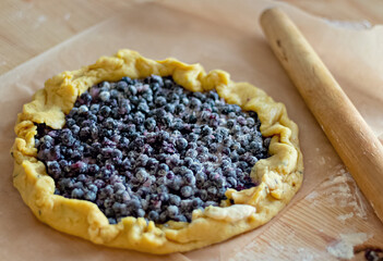blueberry pie on a wooden board