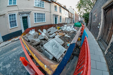 Wide angle fisheye view of building waster in a skip