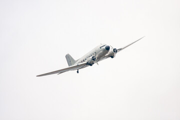 Fototapeta na wymiar Historical military aircraft of world war 2 in the white sky