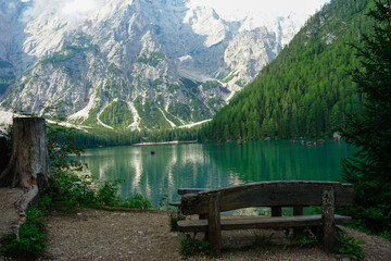 Fototapeta na wymiar Empty bench close to Braies Lake, Dolomites, Unesco, Sudtirol, Trentino Alto Adige, Italy