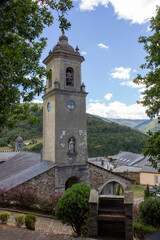 Fototapeta na wymiar image of the parish church san martin de los oscos with a background of mountains and clouds