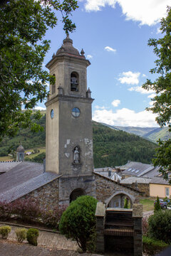 image of the parish church san martin de los oscos with a background of mountains and clouds