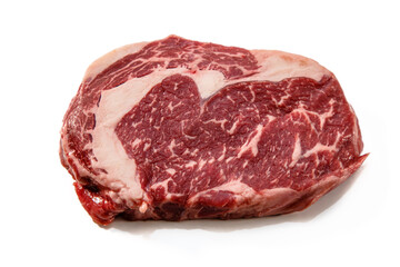 Ribeye. A raw marbled beef steak sits on a white background with a shadow.