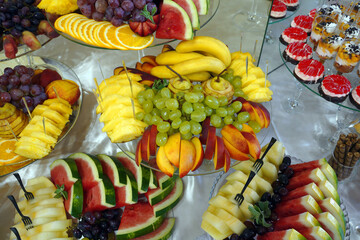 fruits and berries on a buffet table. catering at the wedding