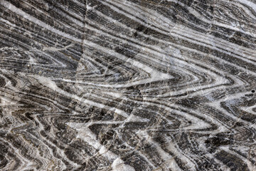 Abstract gray texture of natural, raw salt in an underground salt mine