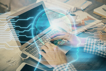 Man typing on keyboard background with brain hologram. Concept of big Data.