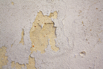 fragment of a wall with cracked plaster