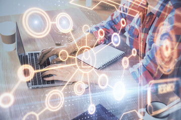 Social network theme hologram with businessman working on computer on background. Concept of world wide web. Double exposure.
