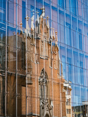 Naklejka premium Facade of a church reflecting on glass wall