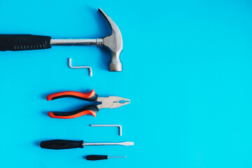 Tools for repair on a blue background.