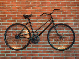 Black bike on a brick wall