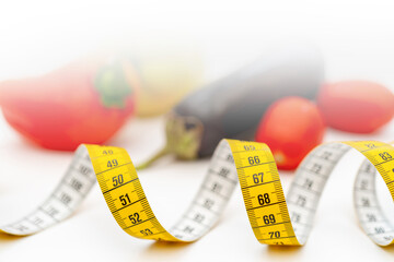 Yellow measuring tape. Fresh vegetables for healthy lifestyle diet food.