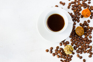 Coffee espresso and truffles balls on the plate