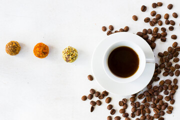 Coffee espresso and truffles balls on the plate