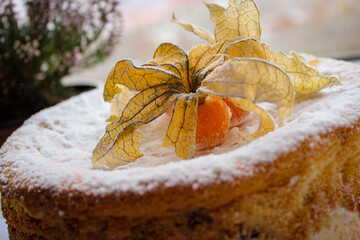 Incredibly Delicious Home Baked Cake. The Top Is Decorated With Edible Physalis Fruits.