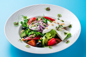 Greek salad on a blue background