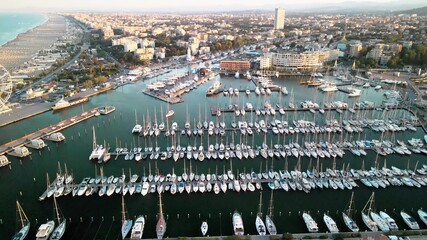 Obraz na płótnie Canvas Aerial view of Rimini Port and Docked Boats in summer season, Italy