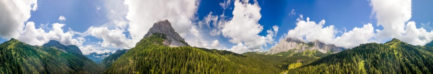 Aerial panoramic view of Dolomite Mountains. Val Sesis Valley in summer season