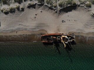 ship beached during a storm from a bird's eye view 