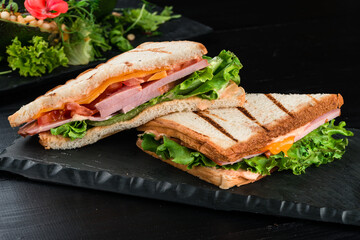 grilled sandwich with ham and salad