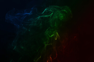 Beautiful colorful smoke abstract on black background. Background from the smoke of vape