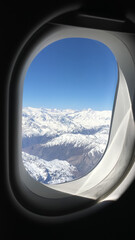 Andes Mountains through airplane window 