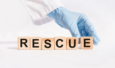 Wooden blocks with the word Rescue. Medical concept.