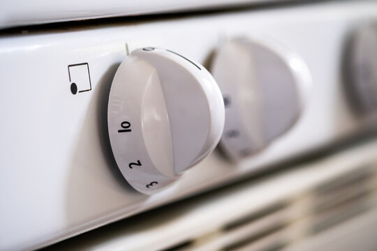 Extreme close up of burner control knobs on a residential gas stove