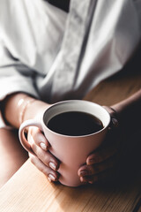 A woman is reading a book. Education, training, learning, hobby. Manicure