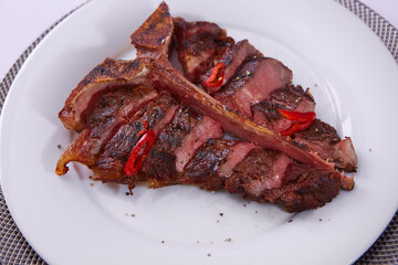The T-Bone Steak on white plate. Shallow dof