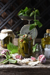 Salted cucumbers. Spices and herbs for making pickles on wooden background
