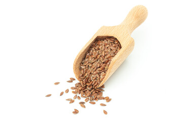 Heap of Flax seeds or linseeds in wooden scoop isolated on white background. Flaxseed concept, dietary fiber 