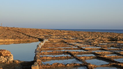 Sunrise over Xwejni Saltpans in Gozo (Island of Malta)