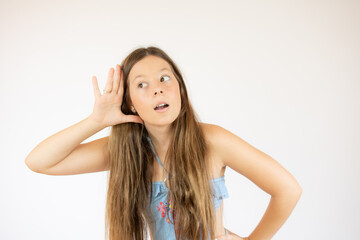 Fototapeta premium Beautiful girl with long hair making the listening gesture
