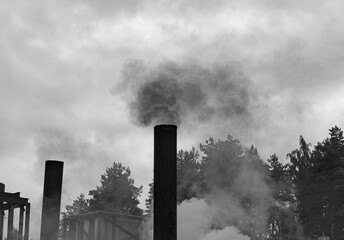 black white photo of smoke from the chimney