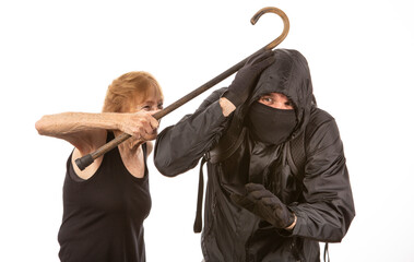 Aggressive senior citizen slapping a protestor across the head with her cane as he tries to defend himself!