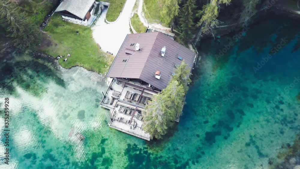 Poster Aerial view of beautiful Chalet along the mountain lake