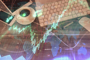 Double exposure of forex chart hologram over desktop with phone. Top view. Mobile trade platform concept.