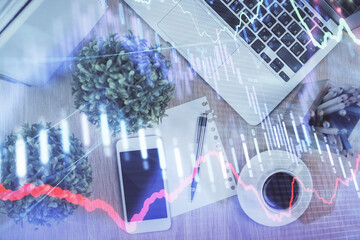 Multi exposure of financial chart hologram over desktop with phone. Top view. Mobile trade platform concept.