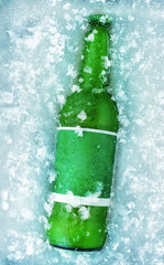 A bottle of beer in ice