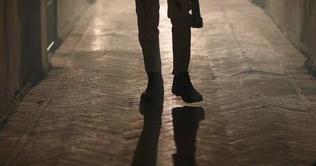 Creepy senior mustached maniac walking in hallway. Bloodlust butcher covered in blood carrying an axe, dressed for a halloween thematic party 4k footage