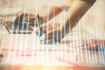 Multi exposure of woman hands typing on computer and financial chart hologram drawing. Stock market analysis concept.