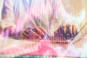 Double exposure of woman hands typing on computer and forex chart hologram drawing. Stock market invest concept.