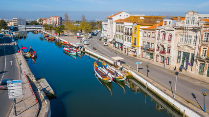 Fototapeta na wymiar Aerial view of the city of Aveiro Portugal. Beautiful image of the canals, boats and historic center of Aveiro