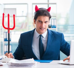 Devil angry businessman in the office