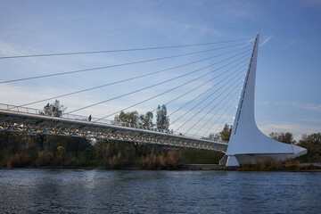 The Sundial Bridge, a cantilever spar cable-stayed and glass-decked bridge for bicycles and pedestrians that spans the Sacramento River in Redding, California, during sunset.