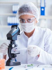 Female scientist researcher conducting an experiment in a labora