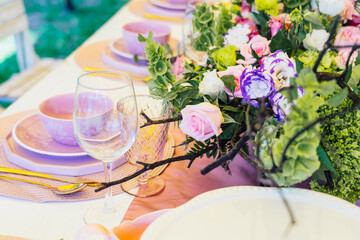 Close up of flower decoration of the table with the focus on the brunches